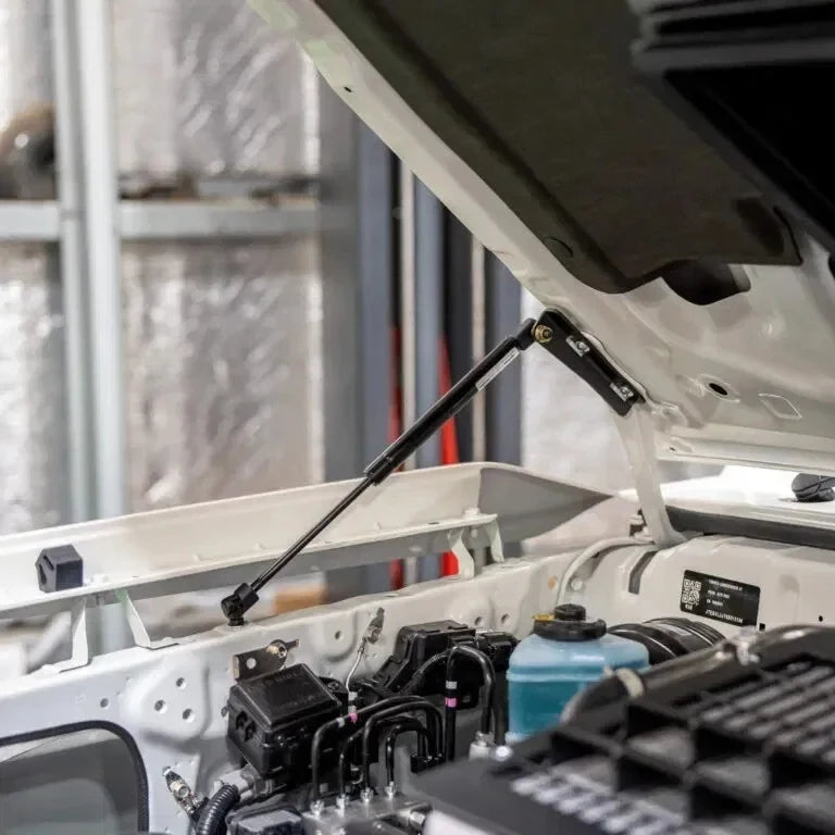 70 Series Land Cruiser Bonnet Gas Struts holding the bonnet open above the engine bay