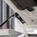 Close-up of the 70 Series bonnet gas strut mounting bracket bolted to the bonnet with the strut ball stud fitted